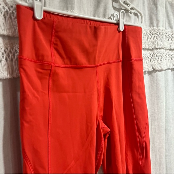 Athleta x Peloton Velocity 7/8 Orange Leggings with Zipper Pouch - Picture 3 of 11